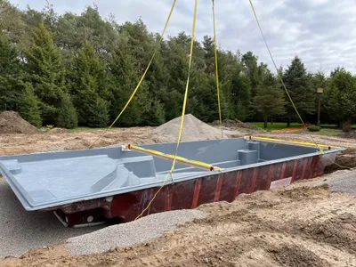 Fiberglass pool installation in progress