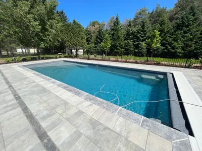 Automatic pool cover on a fiberglass pool