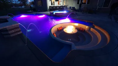 Colour-changing LED lights inside a pool at night